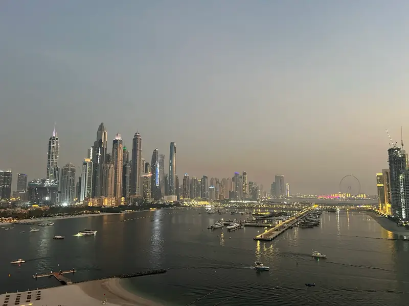 Dubai Marina towers across the water at dusk