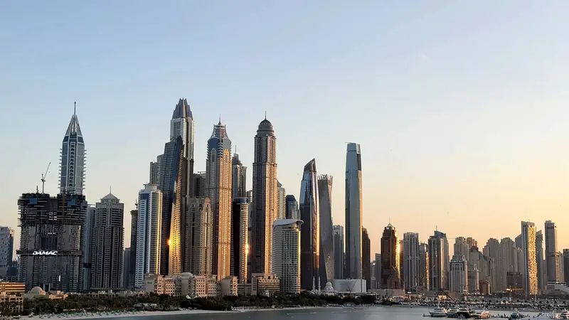Dubai Marina skyscrapers lit by low evening sun